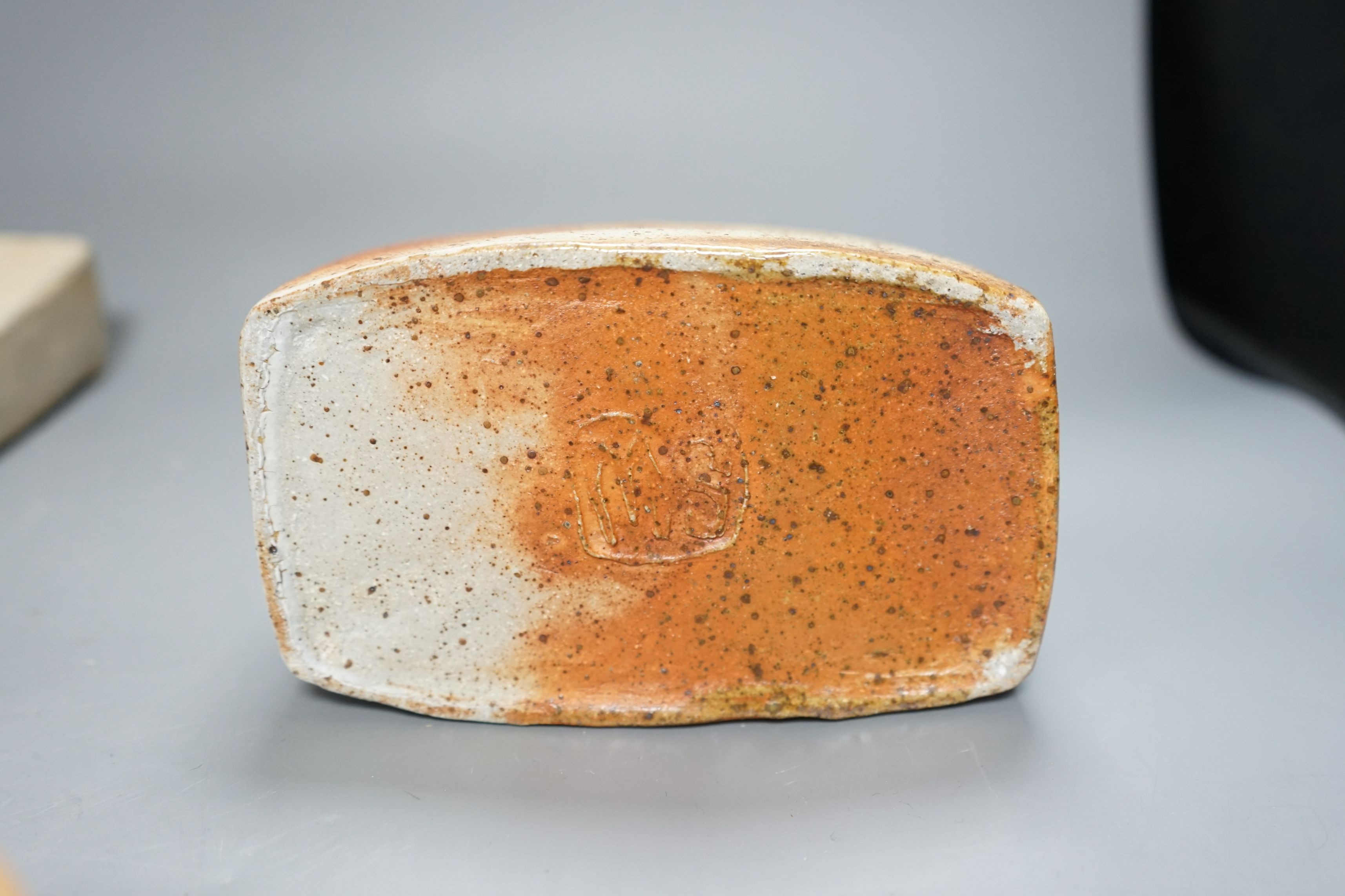 Sarah Walton (b.1945), a salt glazed stoneware flower brick, together with a salt glazed butter dish and cover, a similar mug, and a ‘Field’ horizontally carved linear slab, 22cm wide, all with impressed marks, (4)